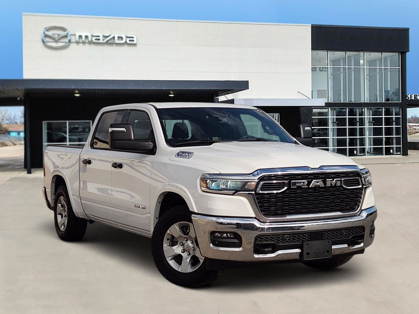 2025 RAM 1500 Big Horn/Lone Star in Bright White Clearcoat — front three-quarter view