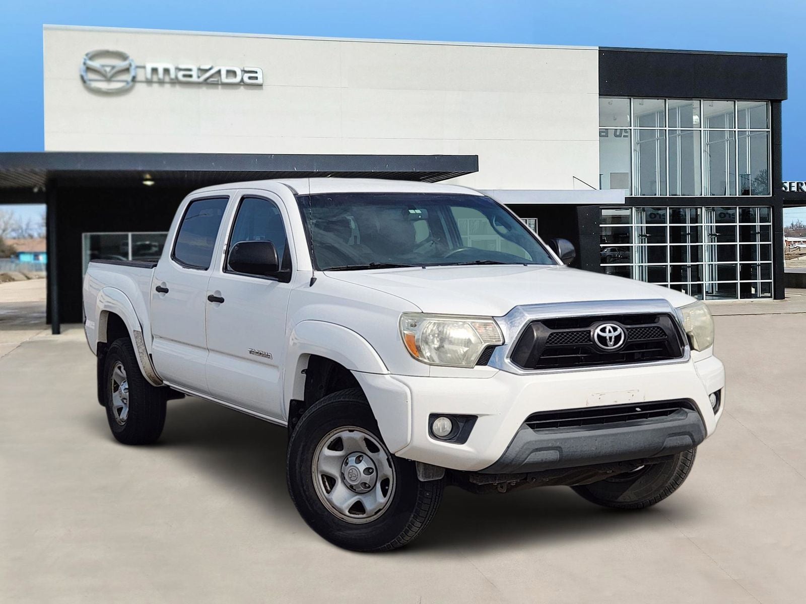 2013 Toyota Tacoma PreRunner V6 in Super White — front three-quarter view