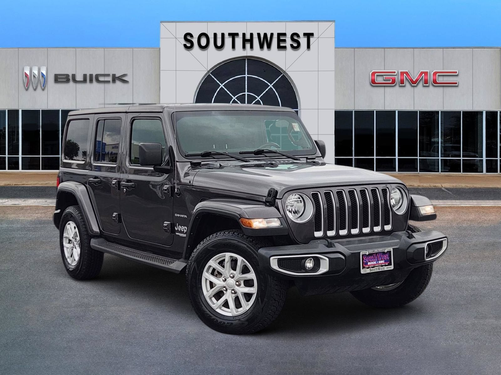 2022 Jeep Wrangler Unlimited Sahara in Black — front three-quarter view